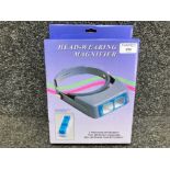 Head-wearing magnifier with spare glasses new and boxed