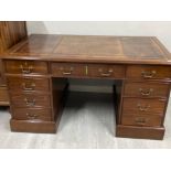 Mahogany brown leather topped writing desk fiitted with 7 drawers (2x dummy drawers) with key