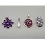 Four silver pendants three with purple stones and one CZ