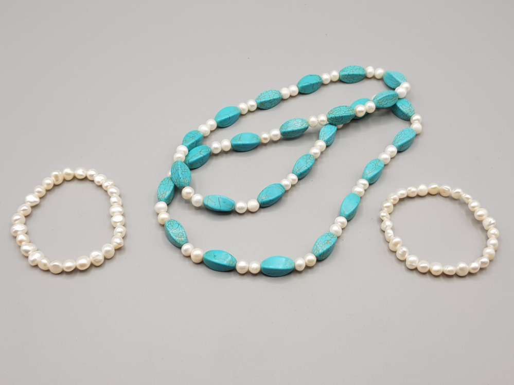 A pearl and turquoise necklace and two pearl bracelets