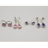 Four pairs of silver and CZ earrings with pink and purple stones