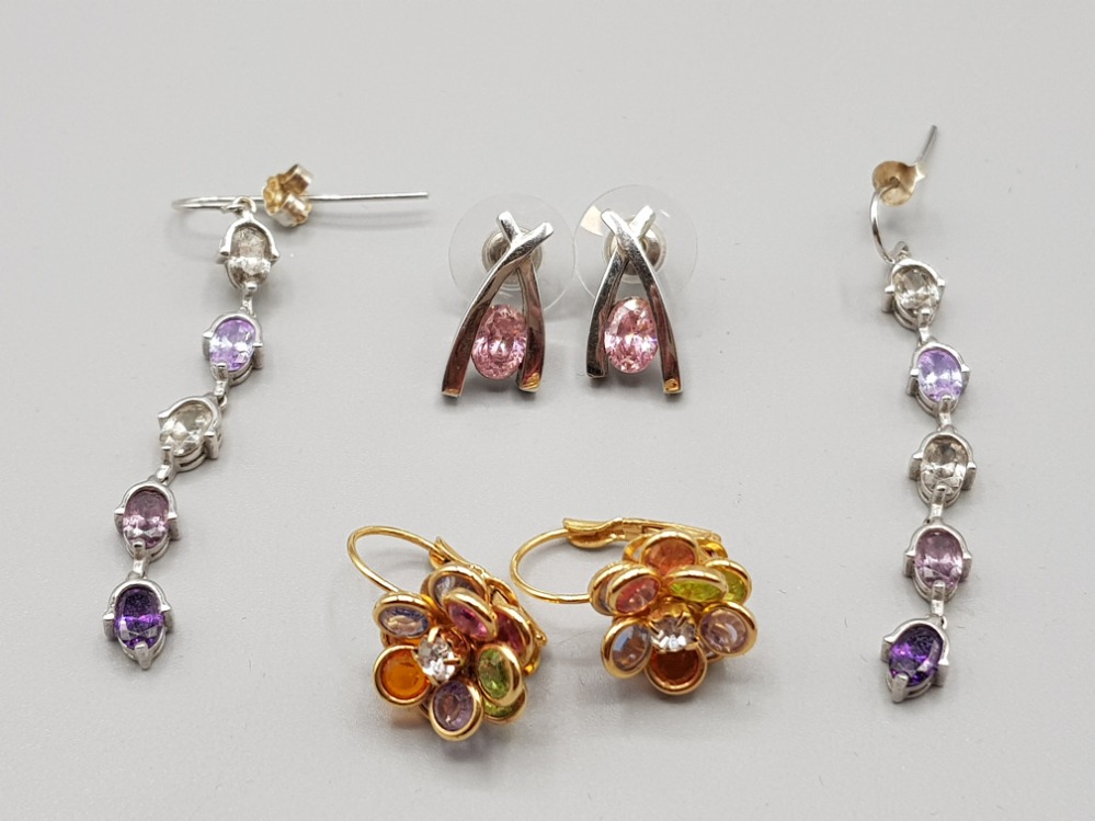 Two pairs of silver and coloured stone earrings and a pair of gold coloured earrings