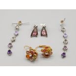 Two pairs of silver and coloured stone earrings and a pair of gold coloured earrings