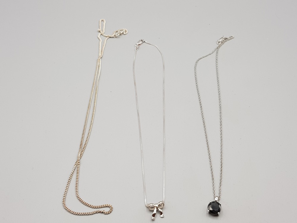 Two silver pendants and three silver chains
