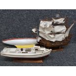 A model galleon pirate ship and two boats