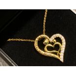 Silver gilt heart shape pendant & chain, heart inscribed “home is where my mum is” with CZ stones,