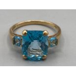 A 9ct yellow gold and blue stone ring size S 3.7g gross