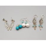 Four pairs of silver earrings three with turquoise