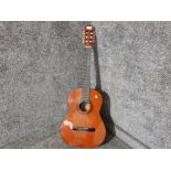 An acoustic guitar by Rocket Music no C542