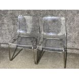 Pair of Perspex transparent chairs - both on metal supports