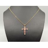 Ladies 9ct gold ruby and diamond cross pendant and chain. 2.7g