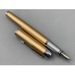 Brilliant champagne gold Parker fountain pen with fine nib & case (small dent on cap)