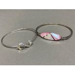2 silver 925 bracelets to include a CZ bow & white design along side a pink enamel design weighing
