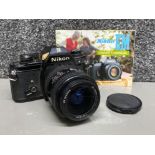 Nikon EM 35mm SLR camera with Nikon AF Nikkor lens 28-70mm, with owners manual