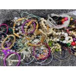 Box of miscellaneous costume jewellery to include bangles, necklaces, simulated pearls etc