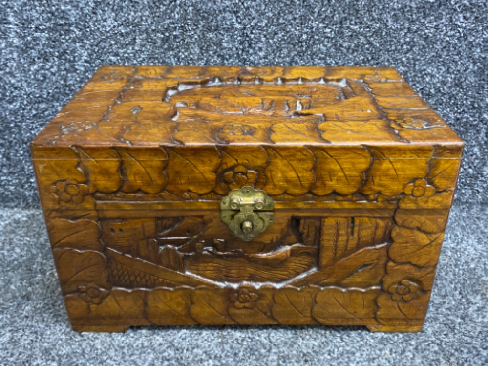 Heavily carved oriental style jewellery box with brass lock fitting 30x18cm