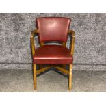 Oak framed & metal studded armchair with upholstered burgundy leather back rest & seat pad