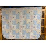 A large double bed quilt with floral decoration