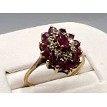 Ladies gold rudy stone cluster ring. Featuring 13 ruby stones. 2.1g size O