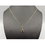 Ladies 9ct gold sapphire and diamond pendant and chain. Featuring a oval sapphire and 3 round