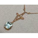 9ct gold pendant with light blue stone on 9ct gold chain, 2.6g