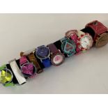 Cylindrical display tube presenting 10 different ladies wristwatches