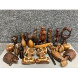 A large quantity of small African and Asian wooden carvings and a pair of plaster busts