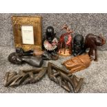 Box lot containing miscellaneous african & tribal carvings including giraffes, elephant, busts &