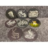 Set of 8 circular shaped slate plaques each with a hand painted design (mainly animals)