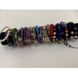 Cylindrical display containing 25 different costume bracelet including silver 925 cuff