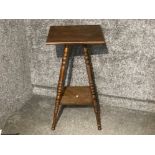An early 20th century oak plant stand