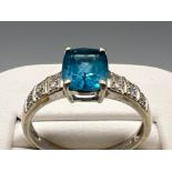 Ladies 9ct white gold blue topaz and diamond ring. 6 round brilliant cut diamonds with blue topaz in
