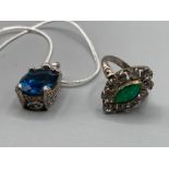 Silver ring with white and green stones and a silver and blue stone necklace on silver chain