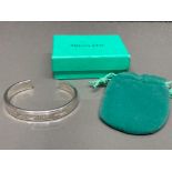 A silver Tiffany & Co style torque bangle 31.6g, boxed