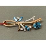 14ct yellow gold blue & white stone floral themed brooch, 4.1g gross