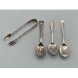 Three silver coffee spoons and silver sugar nips 50.7g
