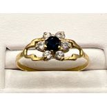 Ladies 18ct gold sapphire and white stone cluster ring. Size P
