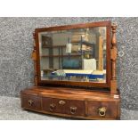 A 19th century mahogany swing toilet mirror with three single drawers