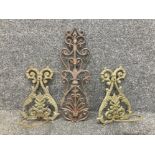 A pair of cast metal garden sconces and another