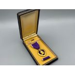 WWII U.S army Purple Heart medal in original box (includes button & ribbon sections)