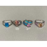 Four silver, enamel and coloured stone rings 18.3g gross