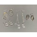 Four pairs of silver earrings to include star decorated ones 28g