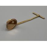 Gents 9ct gold diamond tie tack. Set with single diamond and safety chain. 3.4g