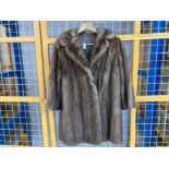A brown mink fur 3/4 length coat