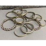 Total of 11 antique metal costume bangles, mainly in a oriental style, includes a pair of handmade