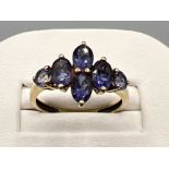 Ladies 9ct gold purple stone cluster ring. 2g size Q