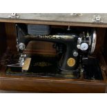 Vintage Singer sewing machine with original carry case