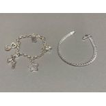 A silver chain link bracelet and a silver charm bracelet 27.2g