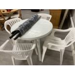 Outdoor plastic table and chairs with two parasols