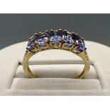 Ladies 9ct gold 5 stone light tanzanite ring. Size N